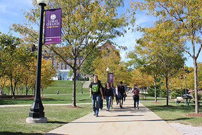 Photo of students walking on campus. Link to Gifts of Real Estate.